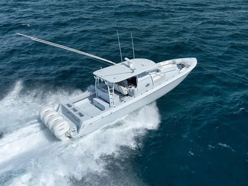 Slide: The Image of 2025 Contender 44 ST boat cruising on open ocean waters. - 4