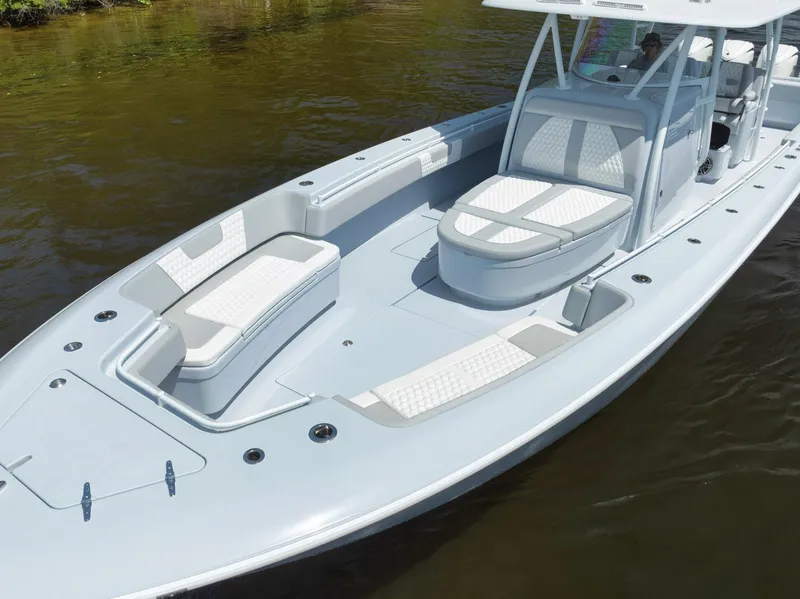 Slide: The Image of 2025 Contender 44 ST boat with sleek design and spacious seating on calm water. - 6