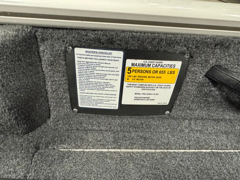 Slide: The Image of 2018 Tracker Pro Guide V-16 WT capacity plate, showing maximum 5 persons or 655 lbs. - 8