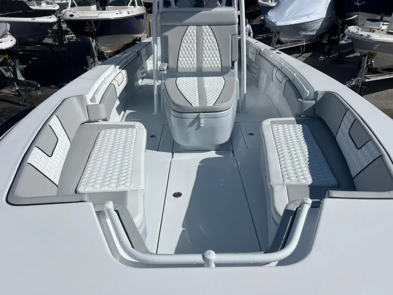 Slide: The Image of 2025 Contender 32 ST boat interior with white cushioned seating and sleek design. - 12