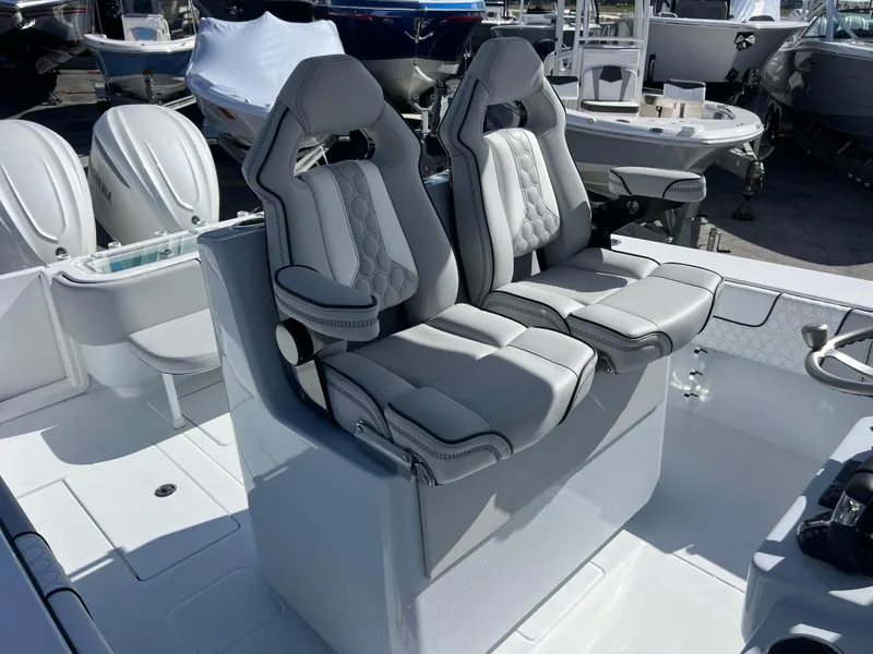Slide: The Image of 2025 Contender 32 ST boat with luxurious dual seats and modern design. - 15