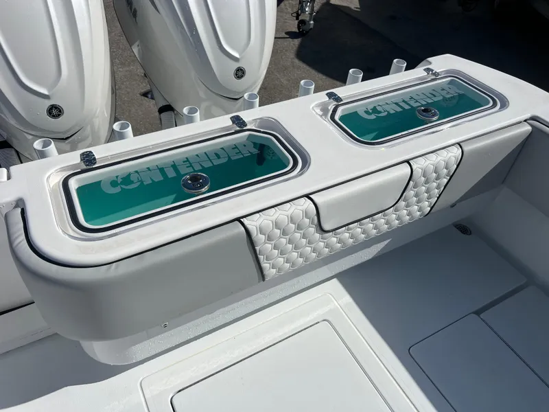 Slide: The Image of 2025 Contender 32 ST boat with dual livewells and sleek design. - 19