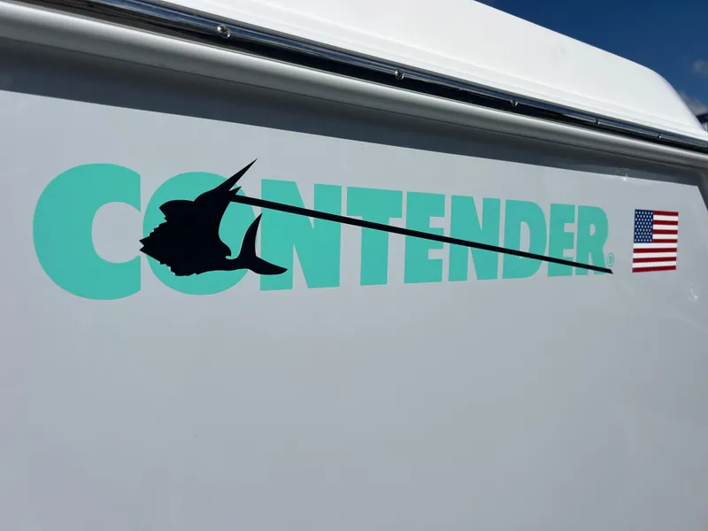 Slide: The Image of Contender 32 ST 2025 boat logo with swordfish silhouette and American flag decal. - 4