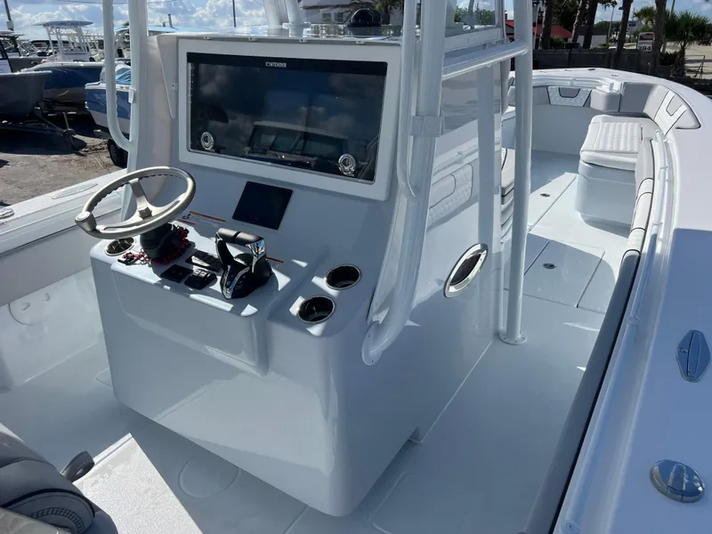 Slide: The Image of 2025 Contender 32 ST boat interior with modern helm and seating. - 9