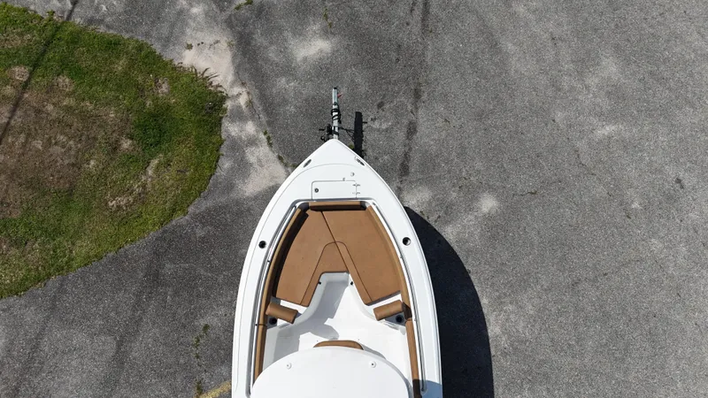 Slide: The Image of 2022 Sea Hunt 229 ULTRA boat, aerial view, parked on pavement. - 11