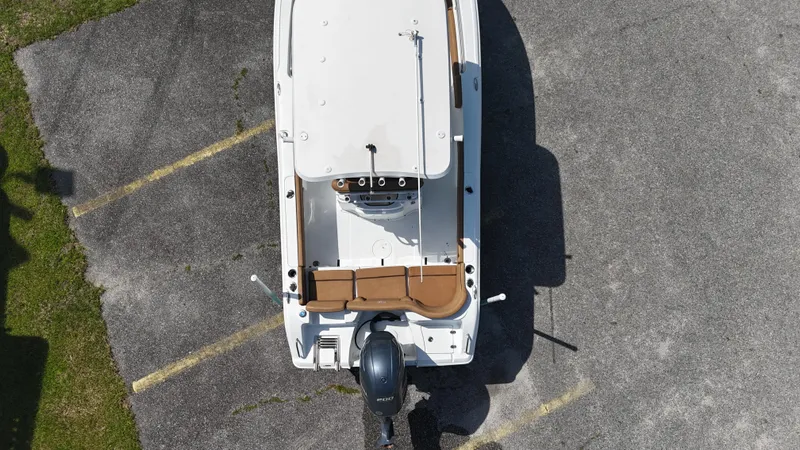 Slide: The Image of 2022 Sea Hunt 229 ULTRA boat, aerial view, parked on asphalt. - 12