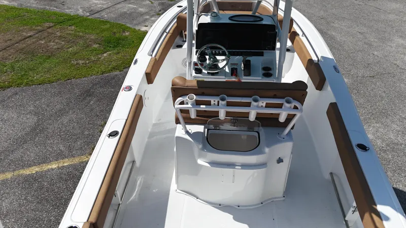 Slide: The Image of 2022 Sea Hunt 229 ULTRA boat interior with console and seating, viewed from above. - 8