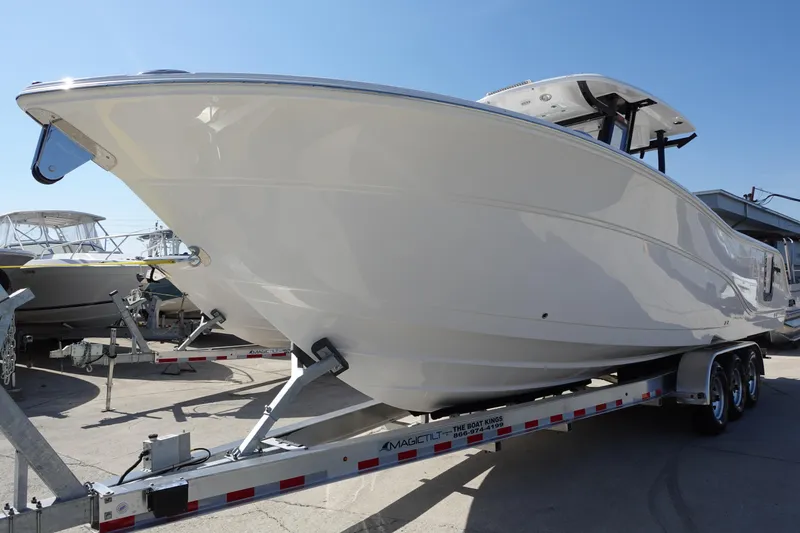 Slide: The Image of 2025 Sea Fox 328 Commander boat dashboard with dual screens and modern controls. - 1