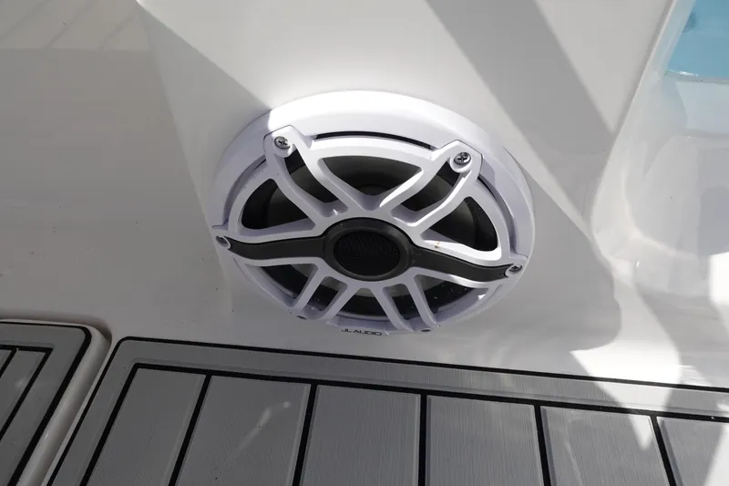 Slide: The Image of 2025 Sea Fox 328 Commander boat console with Yeti cooler on deck. - 15