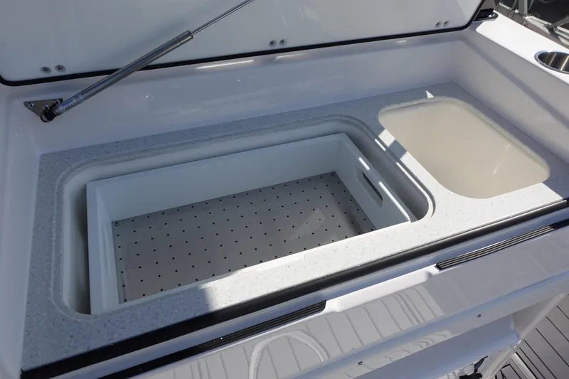 Slide: The Image of 2025 Sea Fox 328 Commander boat storage compartments with drawers and tackle boxes. - 18