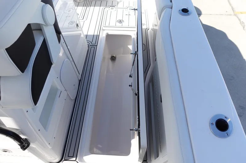 Slide: The Image of Open storage compartment on 2025 Sea Fox 328 Commander boat. - 35