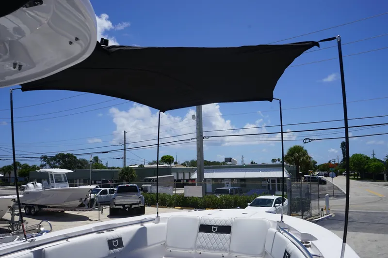 Slide: The Image of 2025 Sea Fox 328 Commander boat on trailer outdoors. - 49