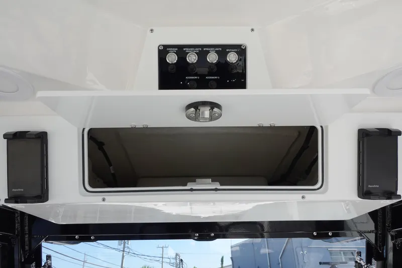 Slide: The Image of 2025 Sea Fox 328 Commander boat interior with seating and dual engines. - 8