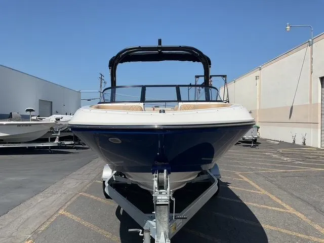 Slide: The Image of 2025 Bayliner VR5 Bowrider I/O on trailer, parked outdoors, front view. - 6