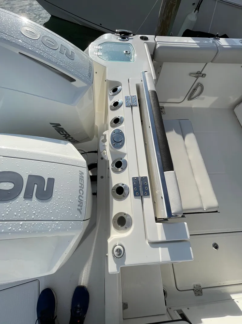 Slide: The Image of 2021 Sailfish 276 DC boat deck with Mercury engines and seating area. - 20