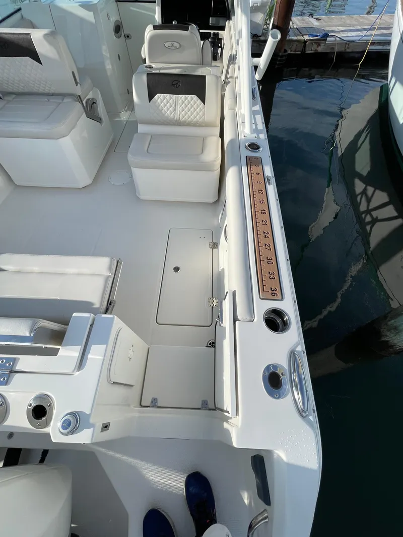 Slide: The Image of 2021 Sailfish 276 DC boat interior with seating and storage compartments. - 21