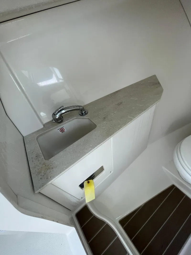 Slide: The Image of 2021 Sailfish 276 DC boat interior with sink and countertop. - 43