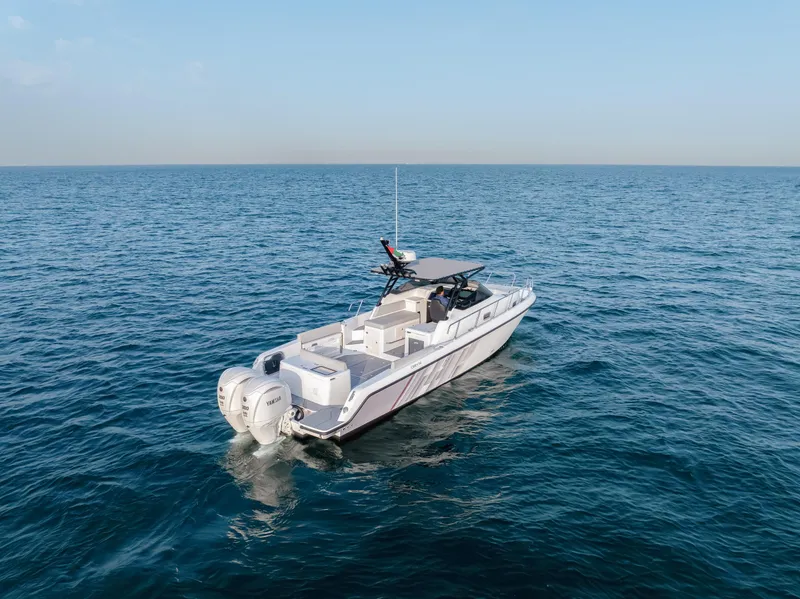 Slide: The Image of Luxury Oryx 32 FX boat cruising on open sea, 2025 model. - 10