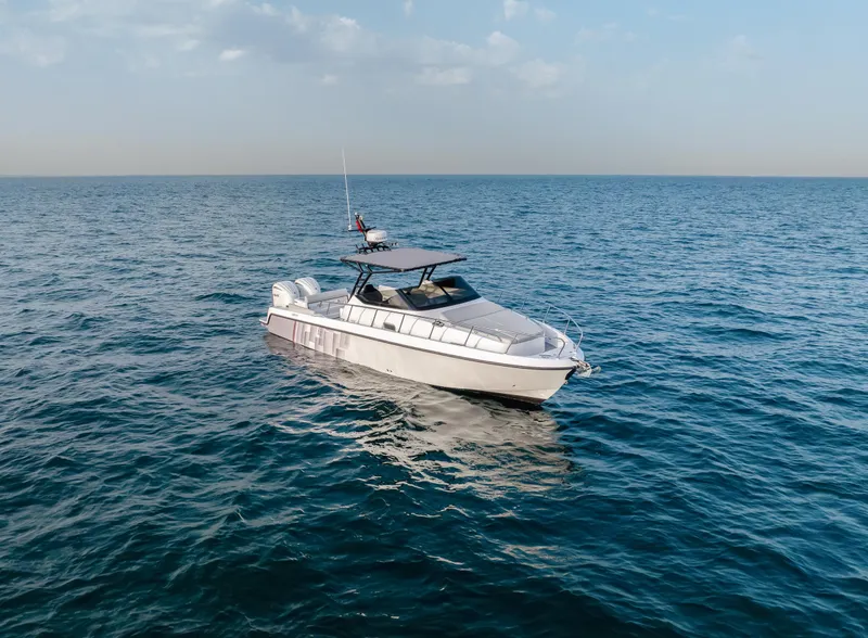 Slide: The Image of 2025 Oryx 32 FX boat cruising on open sea under clear sky. - 5