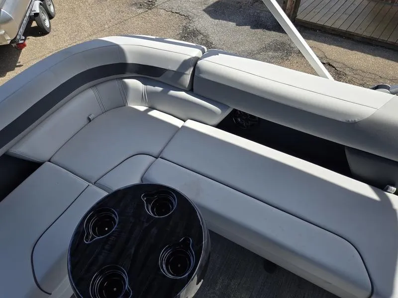 Slide: The Image of 2025 Godfrey Sweetwater 2086 C boat interior with plush seating and cup holders. - 15