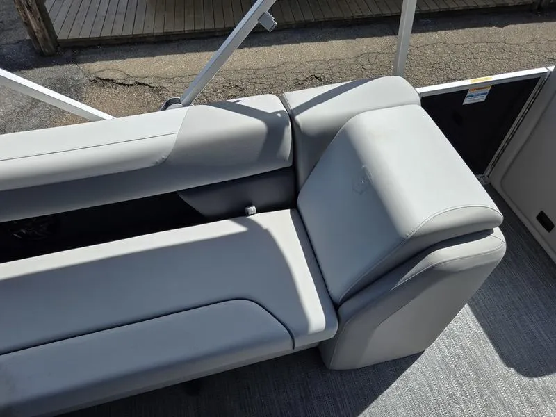 Slide: The Image of 2025 Godfrey Sweetwater 2086 C boat interior with gray seating and modern design. - 16