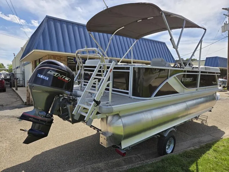 Slide: The Image of 2025 Godfrey Sweetwater 2086 C pontoon boat with Yamaha engine, parked on a trailer. - 4