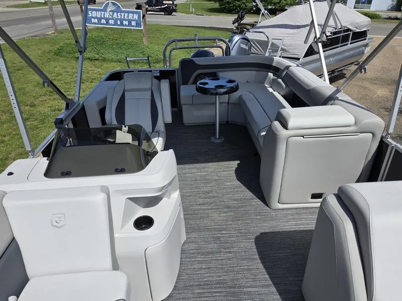 Slide: The Image of 2025 Godfrey Sweetwater 2086 C pontoon boat interior with seating and table at Southeastern Marine. - 7