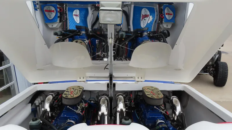 Slide: The Image of 2004 Cigarette 42 Tiger boat engine compartment with dual high-performance engines. - 14