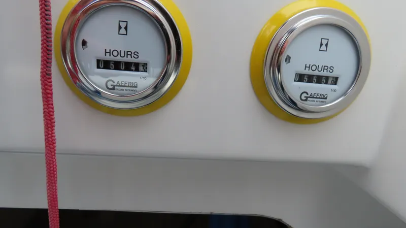 Slide: The Image of Close-up of hour meters on a 2004 Cigarette 42 Tiger boat dashboard. - 17