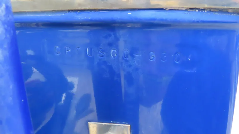 Slide: The Image of 2004 Cigarette 42 Tiger boat hull identification number on blue surface. - 20