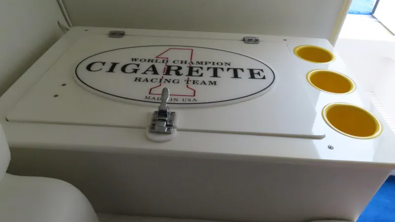 Slide: The Image of 2004 Cigarette 42 Tiger boat compartment with logo and cup holders. - 22
