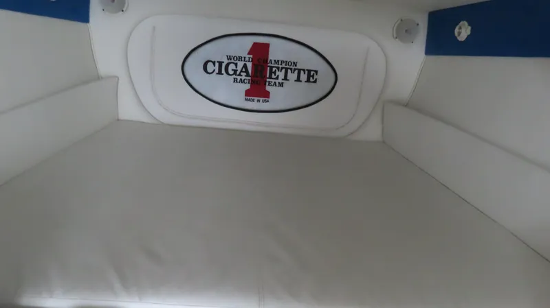 Slide: The Image of 2004 Cigarette 42 Tiger interior with branded cushion and racing team logo. - 23
