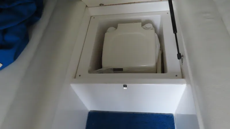 Slide: The Image of Portable toilet in a 2004 Cigarette 42 Tiger boat compartment. - 24