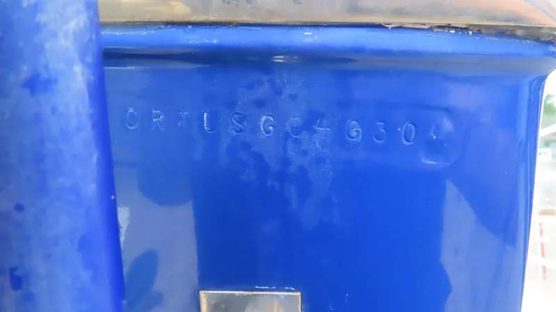 Slide: The Image of Close-up of a blue 2004 Cigarette 42 Tiger boat hull with serial number. - 31