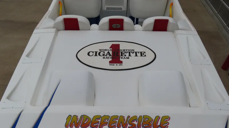 Slide: The Image of 2004 Cigarette 42 Tiger boat interior with racing team logo and "Indefensible" text. - 6