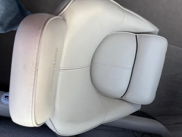 Slide: The Image of White leather seat in a 1999 Crownline 202 boat. - 11