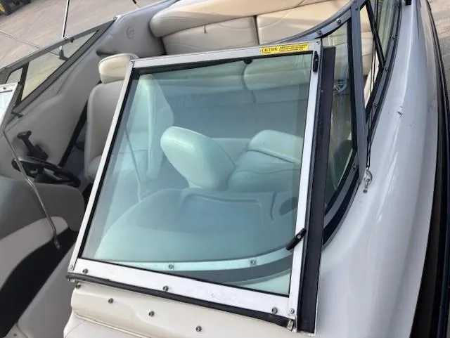 Slide: The Image of 1999 Crownline 202 boat interior with windshield and seating. - 7