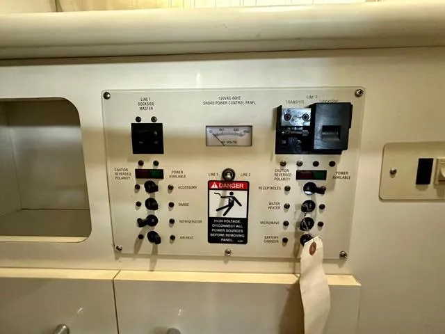 Slide: The Image of Control panel of a 2001 Bayliner 2855 Ciera boat, featuring various switches and indicators. - 14