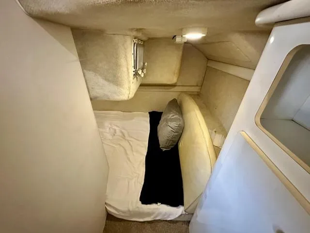 Slide: The Image of 2001 Bayliner 2855 Ciera cabin interior with bed and small window. - 15