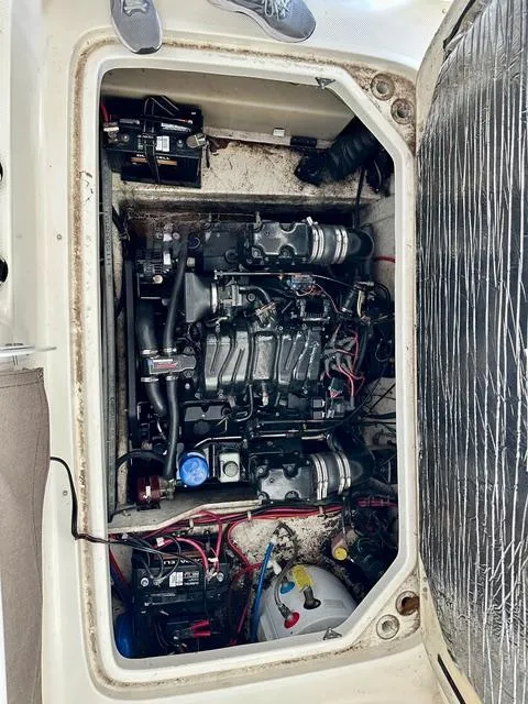 Slide: The Image of Engine compartment of a 2001 Bayliner 2855 Ciera boat, showing detailed mechanical components. - 20