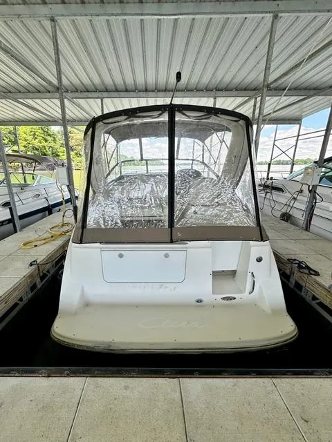 Slide: The Image of 2001 Bayliner 2855 Ciera boat docked under a metal canopy. - 3