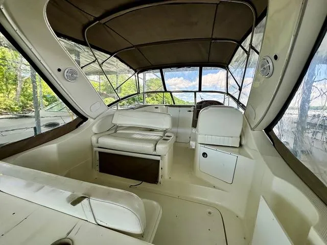 Slide: The Image of 2001 Bayliner 2855 Ciera boat interior with seating and canopy, showcasing spacious design. - 6