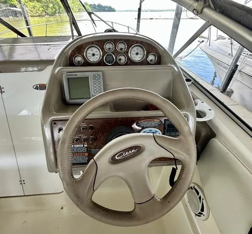 Slide: The Image of Steering console of a 2001 Bayliner 2855 Ciera boat with gauges and controls. - 9