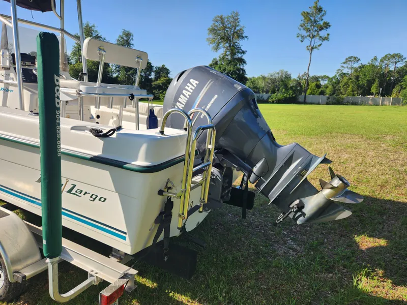 Slide: The Image of 2005 Key Largo 210 CC boat with Yamaha outboard motor on grassy field. - 10