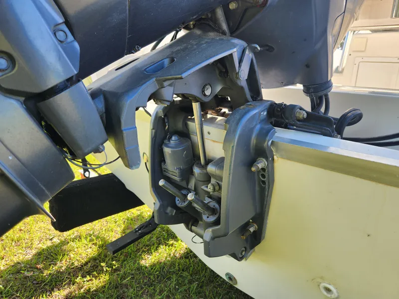 Slide: The Image of Close-up of a 2005 Key Largo 210 CC boat engine component on grass. - 15