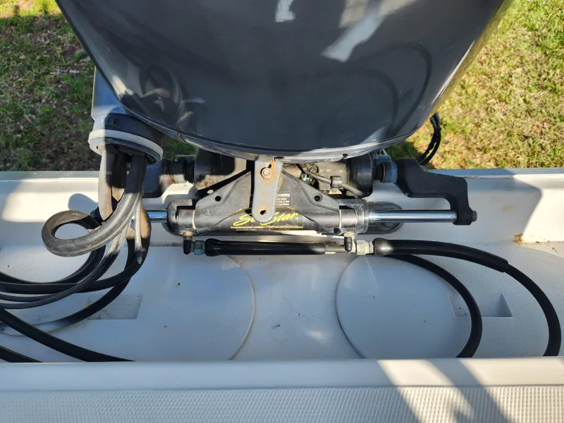 Slide: The Image of Outboard motor and steering mechanism on a 2005 Key Largo 210 CC boat. - 20