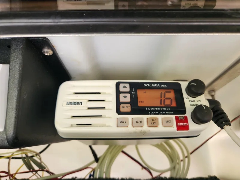 Slide: The Image of Uniden Solara DSC marine radio on a 2005 Key Largo 210 CC boat dashboard. - 27