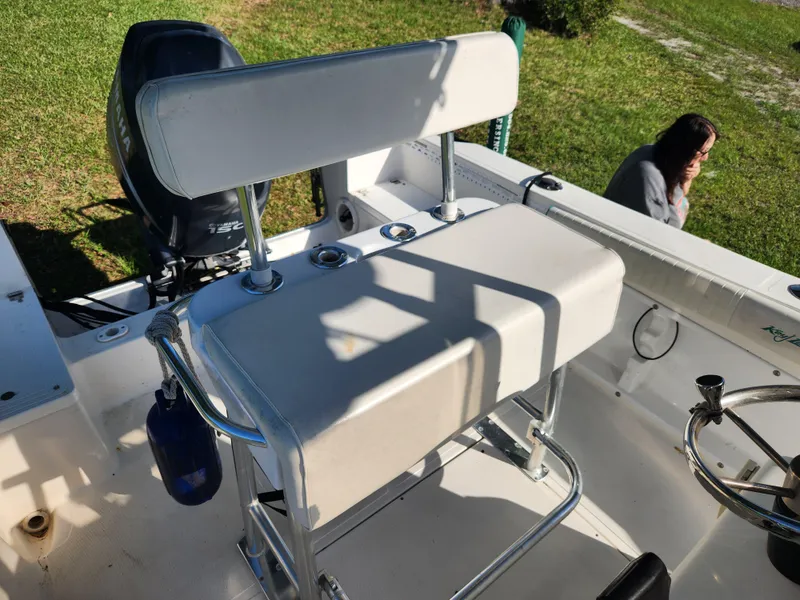 Slide: The Image of 2005 Key Largo 210 CC boat interior with seating and steering wheel. - 31