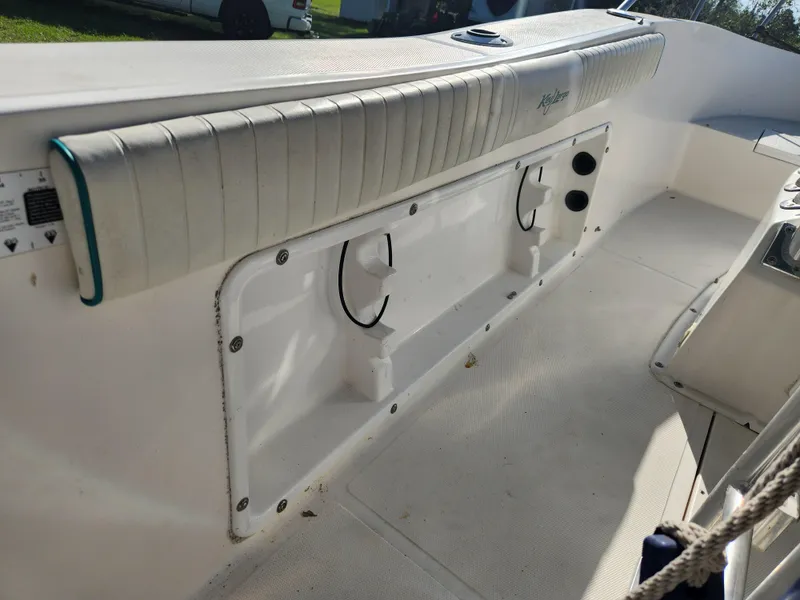 Slide: The Image of Interior view of a 2005 Key Largo 210 CC boat, featuring seating and storage compartments. - 33