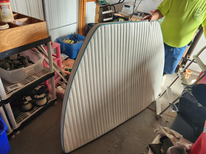 Slide: The Image of Cushioned boat seat from a 2005 Key Largo 210 CC in a workshop setting. - 44